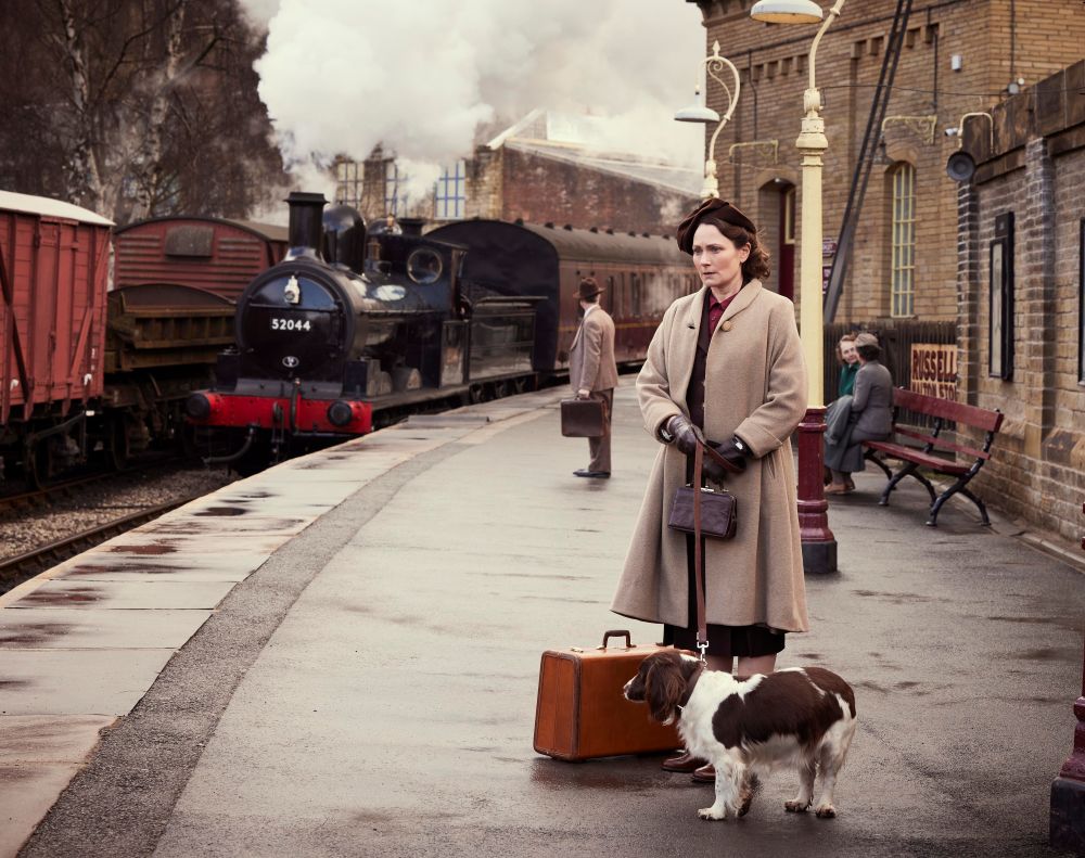 Mrs Hall waiting at the train station platform.