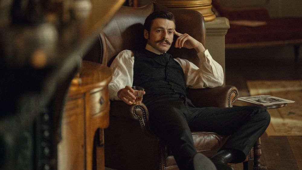Arthur sitting in an armchair.