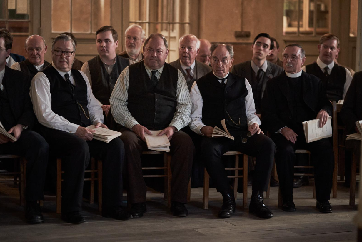 A group of men seated in a choir