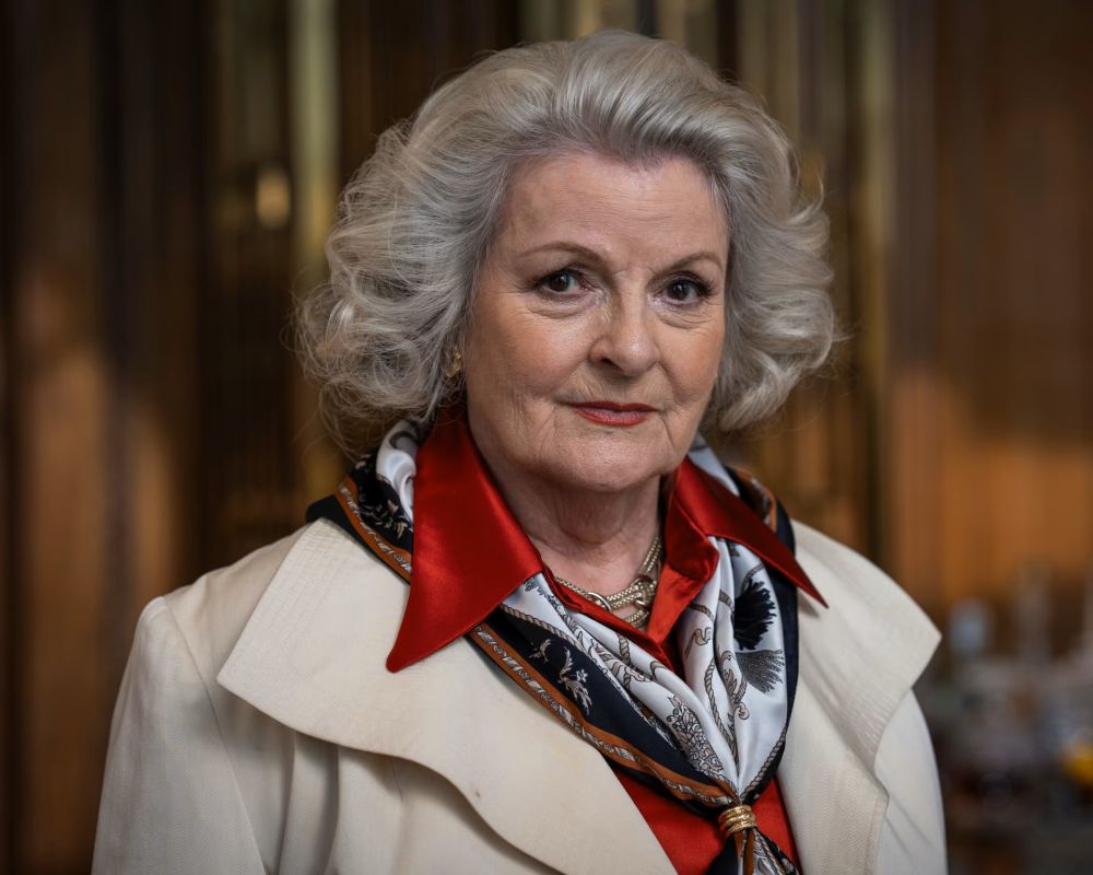 Older well dressed lady in professional clothing.