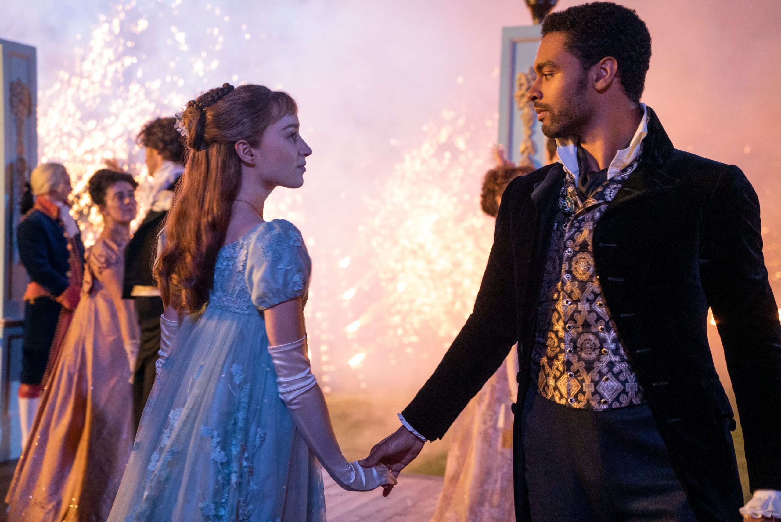 Daphne is a blue dress dancing with the duke at a ball