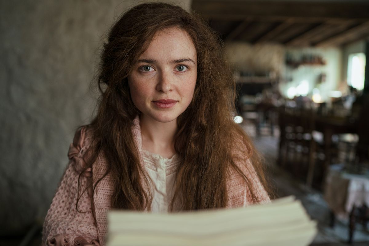 Close up of syblla the main character. Long brown hair. 