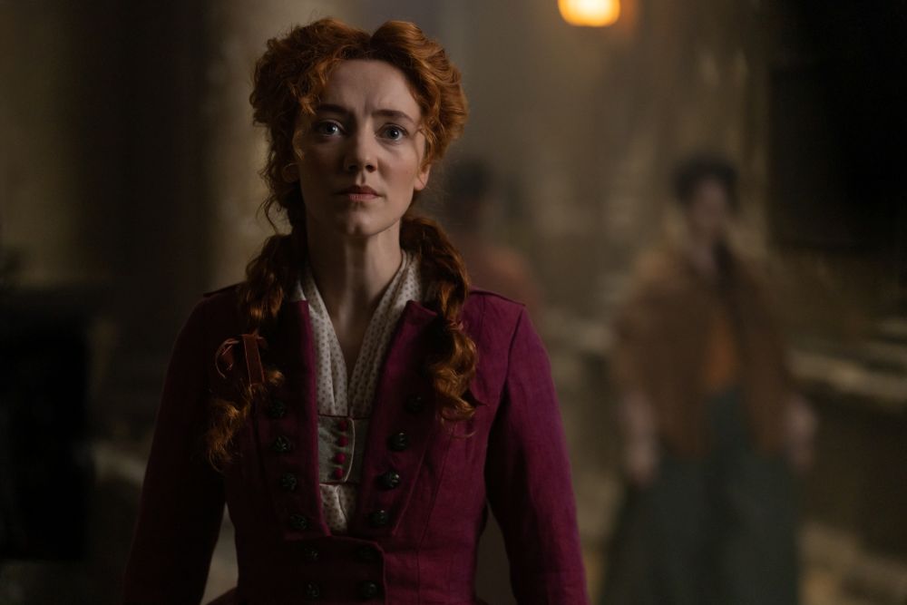 Red haired lady in a burgundy dress