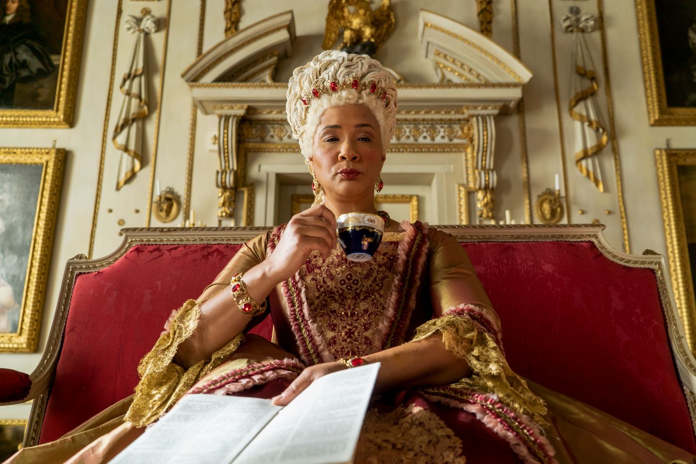Queen Charlotte holding a teacup in Bridgerton Season 1 Episode 5