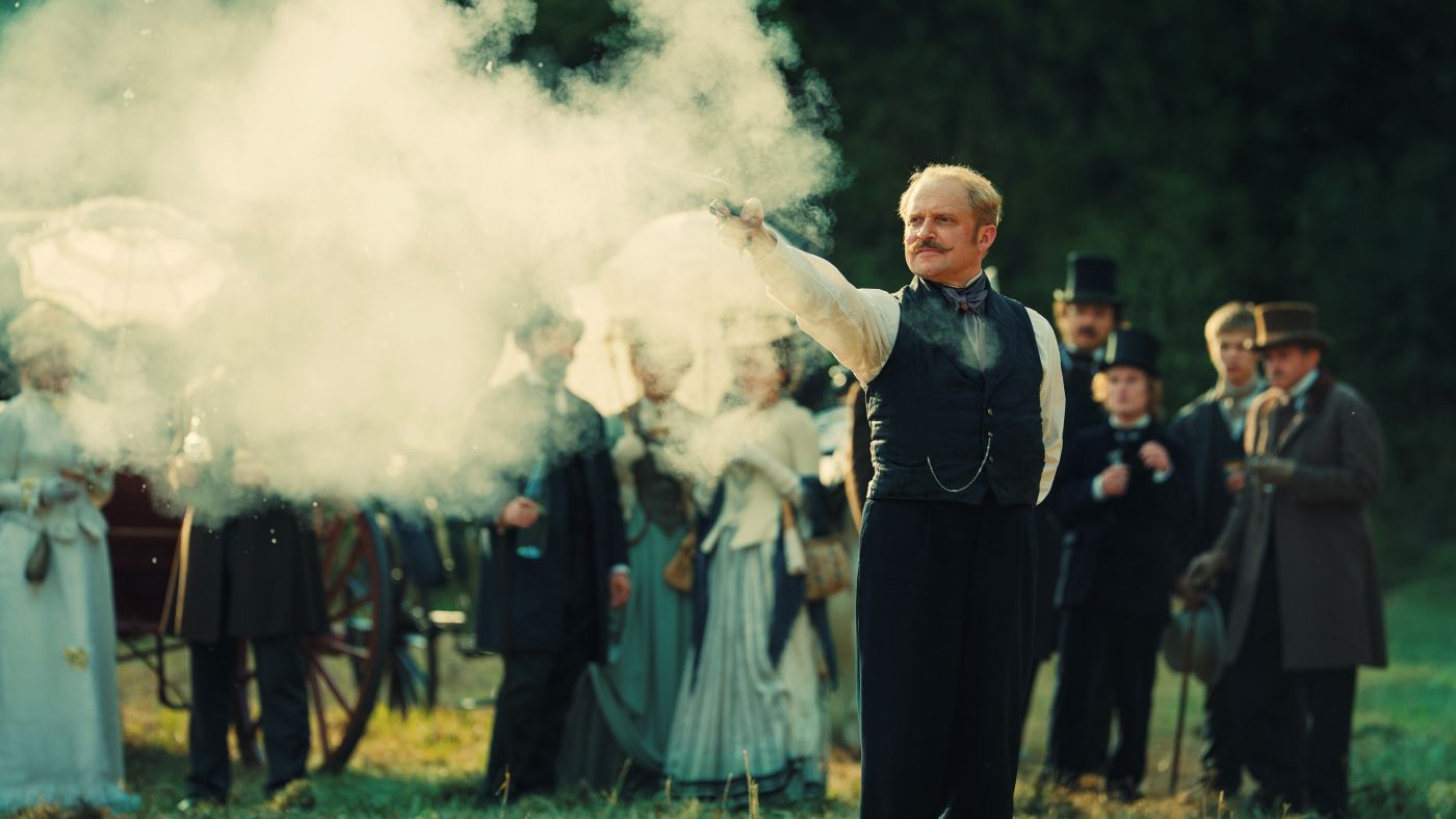 Wokulski fires his pistol during the duel with Baron Krzeszowski in The Doll Episode 4