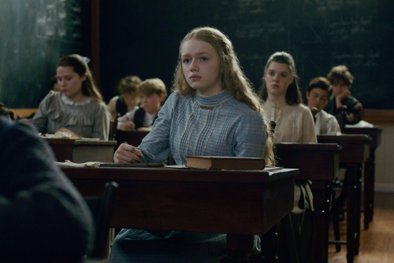 Young Cathy Ames in a classroom at her desk in East of Eden.