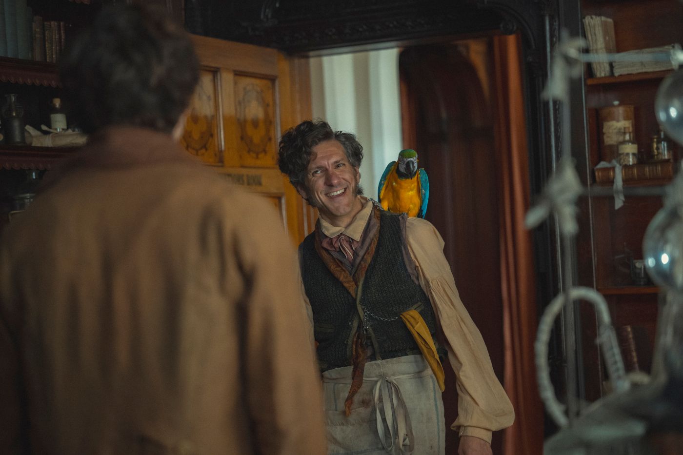 Mathew Baynton as Joseph Rowntree with a parrot in The Cadburys